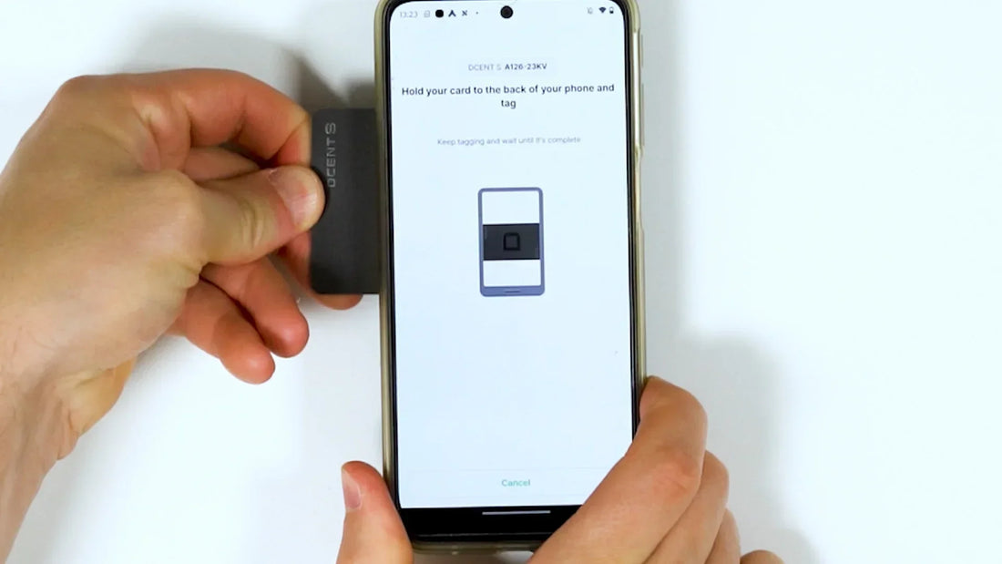 Tapping the DCENT S card on the back of a phone to sign and send a crypto transaction.
