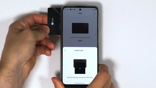 Tapping the Ellipal X Card on the back of a phone to sign and send a crypto transaction.